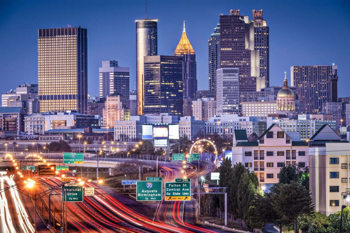 Downtown Atlanta skyline and highway traffic at night, the market where Swartz Co sells businesses