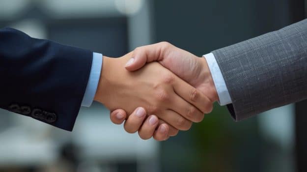 commercial real estate agent shaking someones hand just show their hands